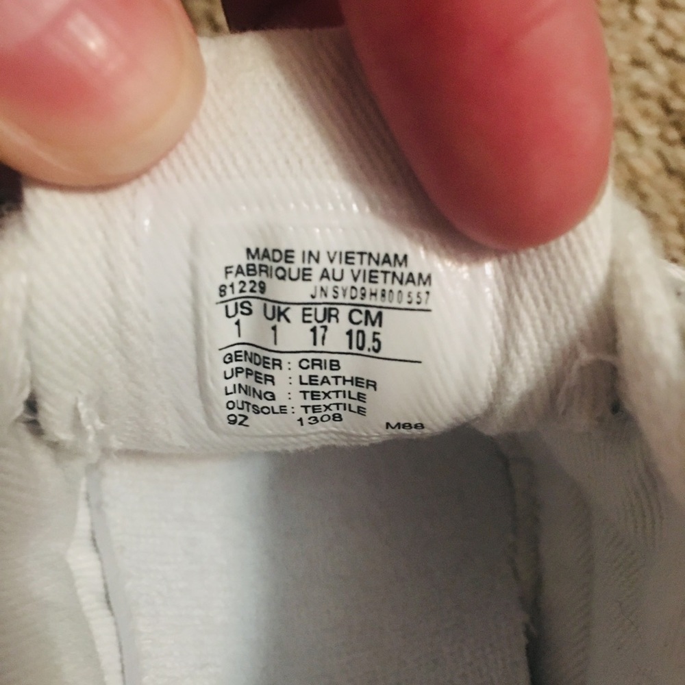 Brand new pair of white baby converses